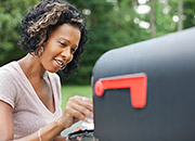 woman checking mailbox